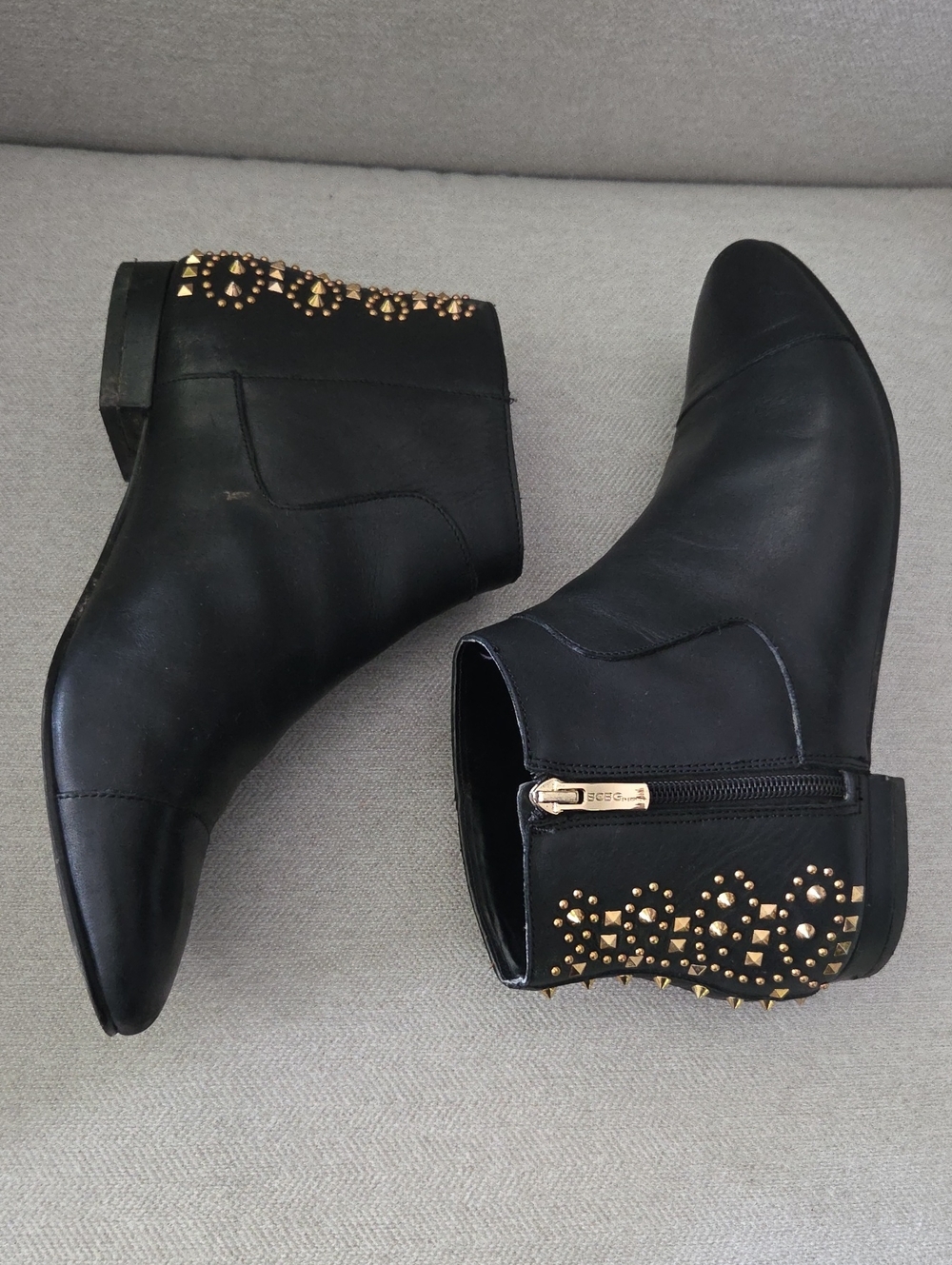 BCBG Logann Black Women's Leather Ankle Booties with Gold Stud Accent